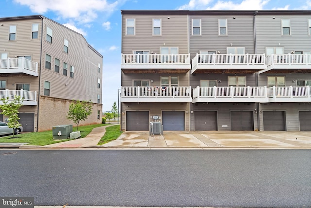 10424 Ratcliffe Trl, Manassas, VA 20110 - view of building exterior with a garage, cooling unit, and driveway