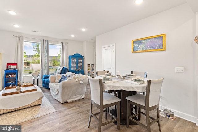 10424 Ratcliffe Trl, Manassas, VA 20110 - dining area with wood finished floors, baseboards, and recessed lighting
