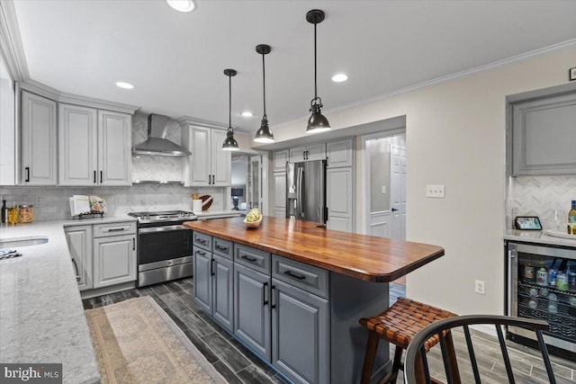 1301 Kelly Ct, Herndon, VA 20170 - kitchen with stainless steel appliances, wall chimney exhaust hood, beverage cooler, butcher block counters, and gray cabinets
