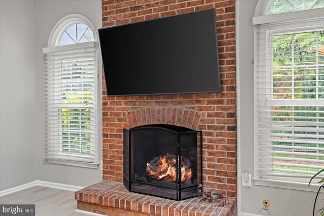 1301 Kelly Ct, Herndon, VA 20170 - detailed view of wood finished floors, baseboards, and a fireplace