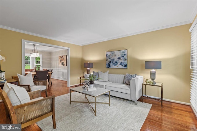 1301 Kelly Ct, Herndon, VA 20170 - living area with crown molding, wood finished floors, and baseboards