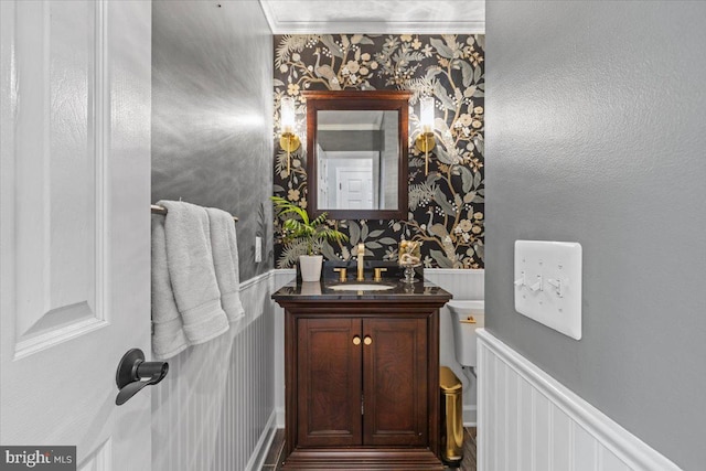 1301 Kelly Ct, Herndon, VA 20170 - bathroom featuring wallpapered walls, vanity, and wainscoting