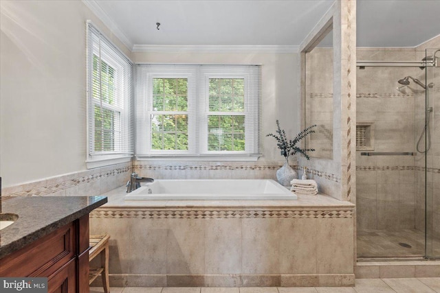 1301 Kelly Ct, Herndon, VA 20170 - bathroom featuring plenty of natural light, a bath, a stall shower, crown molding, and tile walls