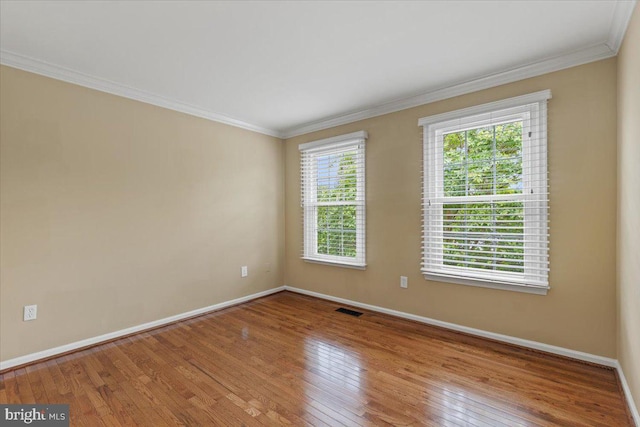 1301 Kelly Ct, Herndon, VA 20170 - spare room featuring baseboards, crown molding, and wood-type flooring