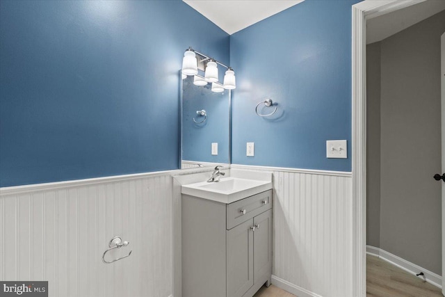 1301 Kelly Ct, Herndon, VA 20170 - bathroom with wainscoting, vanity, and wood finished floors