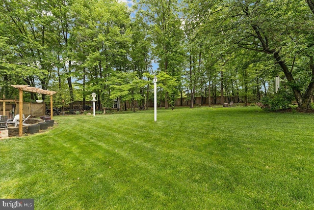 1301 Kelly Ct, Herndon, VA 20170 - view of yard with an outdoor fire pit and view of scattered trees