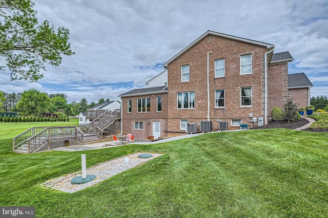 12439 Barnard Way SW, West Friendship, MD 21794 - back of property featuring central air condition unit, a patio, stairway, and brick siding