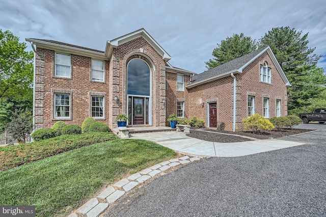 12439 Barnard Way SW, West Friendship, MD 21794 - traditional-style home featuring a front yard and brick siding