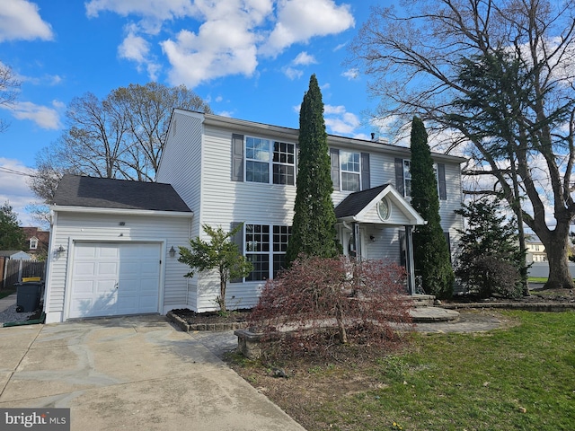view of front of home with an attached garage and concrete driveway