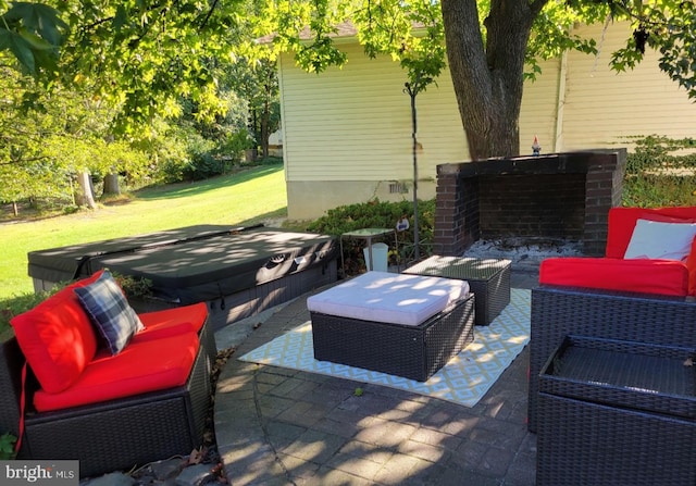 view of patio / terrace with a covered hot tub and an outdoor hangout area