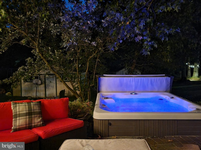 view of pool featuring a hot tub