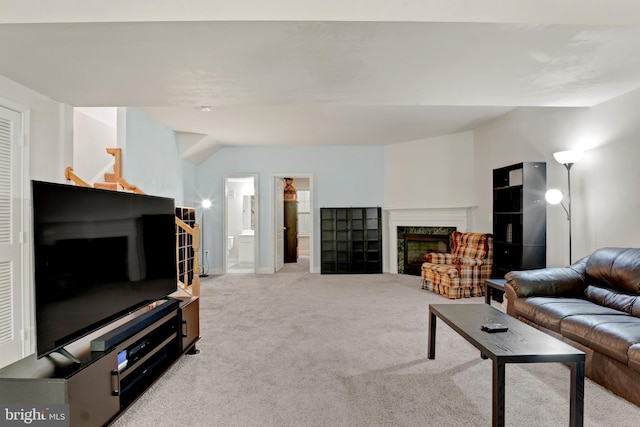 carpeted living room with a fireplace