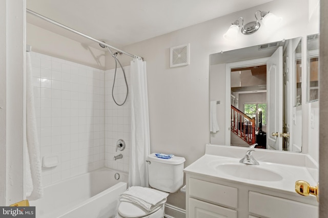 bathroom with visible vents, toilet, shower / tub combo, and vanity