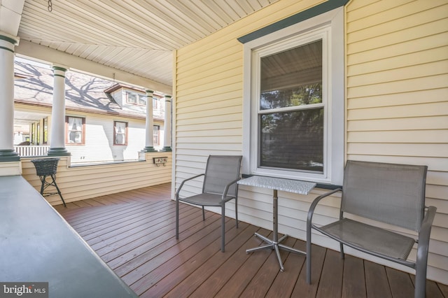 wooden deck featuring covered porch