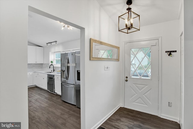 6608 Eaglewing Ln, Fort Washington, MD 20744 - entryway featuring a chandelier, dark wood-type flooring, baseboards, and track lighting