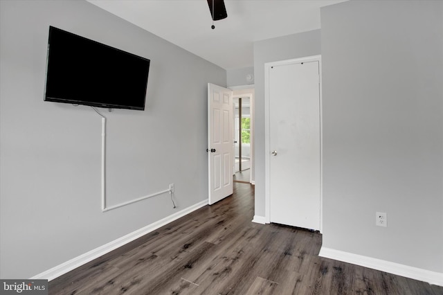 6608 Eaglewing Ln, Fort Washington, MD 20744 - unfurnished bedroom with wood finished floors, baseboards, a ceiling fan, and a closet