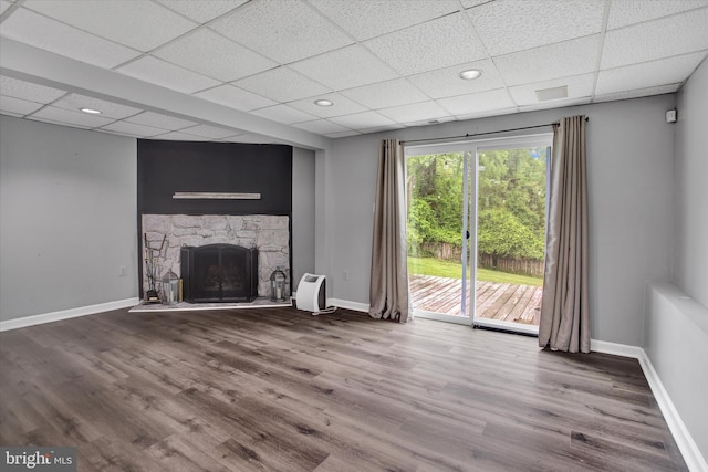 6608 Eaglewing Ln, Fort Washington, MD 20744 - unfurnished living room featuring a paneled ceiling, wood finished floors, baseboards, a fireplace, and recessed lighting
