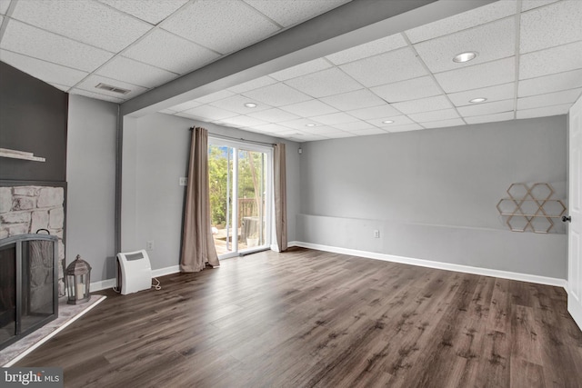 6608 Eaglewing Ln, Fort Washington, MD 20744 - unfurnished living room featuring a drop ceiling, dark wood finished floors, a fireplace, baseboards, and recessed lighting