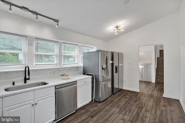 6608 Eaglewing Ln, Fort Washington, MD 20744 - kitchen with appliances with stainless steel finishes, a sink, white cabinetry, vaulted ceiling, and light countertops
