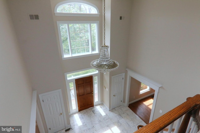 9724 Middleton Ridge Rd, Vienna, VA 22182 - foyer entrance featuring visible vents, a high ceiling, and a notable chandelier