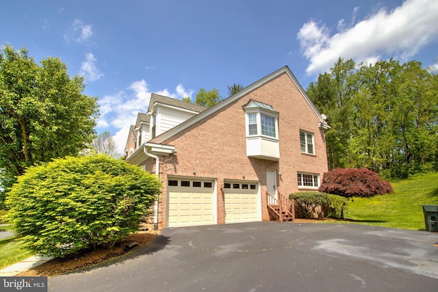 9724 Middleton Ridge Rd, Vienna, VA 22182 - view of property exterior with brick siding and driveway