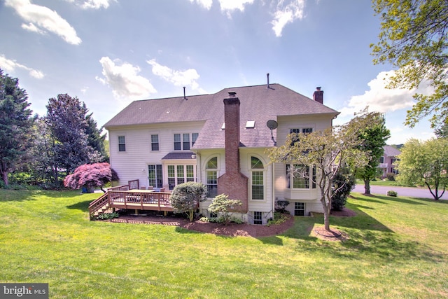 9724 Middleton Ridge Rd, Vienna, VA 22182 - rear view of property with a wooden deck, a shingled roof, a chimney, and a lawn