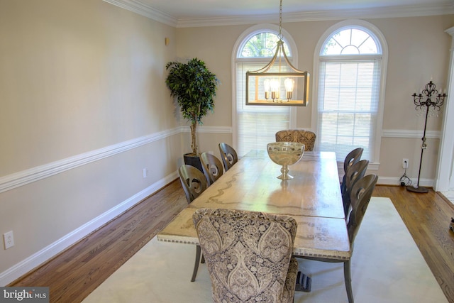 9724 Middleton Ridge Rd, Vienna, VA 22182 - dining space with ornamental molding, baseboards, and wood finished floors