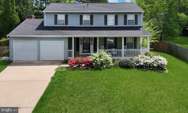traditional home with a front lawn, fence, a chimney, concrete driveway, and a porch