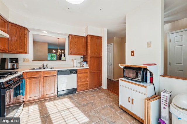 10048 Quiet Brook Ln, Clinton, MD 20735 - kitchen with gas range oven, a sink, dishwashing machine, black microwave, and a chandelier