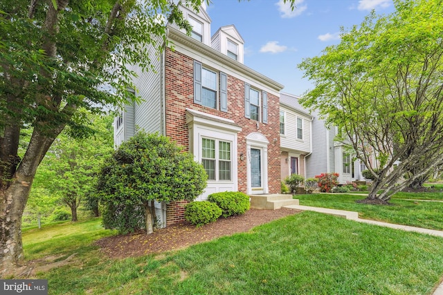 10048 Quiet Brook Ln, Clinton, MD 20735 - view of front facade featuring a front lawn and brick siding