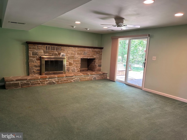 unfurnished living room featuring visible vents, carpet floors, a fireplace, baseboards, and ceiling fan