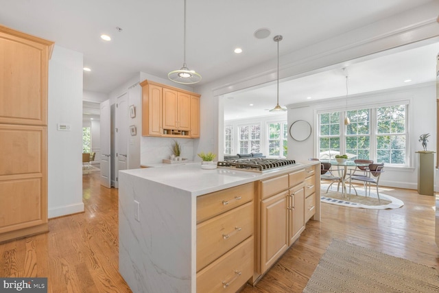 kitchen featuring light brown cabinetry, recessed lighting, stainless steel gas cooktop, and light wood finished floors