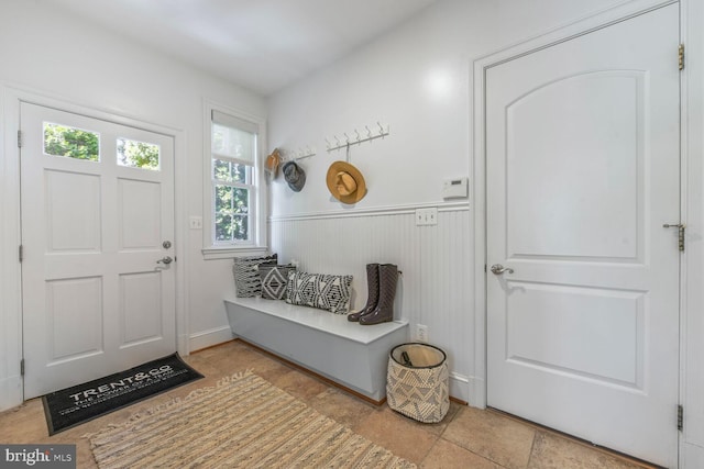 mudroom with a wainscoted wall