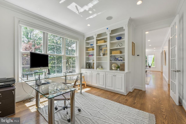office space featuring recessed lighting, ornamental molding, and light wood-type flooring