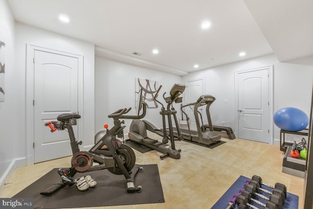 exercise room featuring visible vents, recessed lighting, baseboards, and carpet floors
