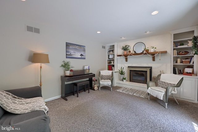 700 Stonecrest Dr, New Holland, PA 17557 - carpeted living room with baseboards, a brick fireplace, recessed lighting, and visible vents