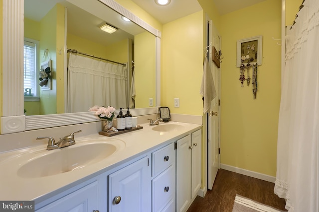 700 Stonecrest Dr, New Holland, PA 17557 - bathroom with double vanity, recessed lighting, a sink, and wood finished floors