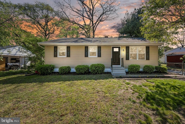 single story home with fence and a front yard