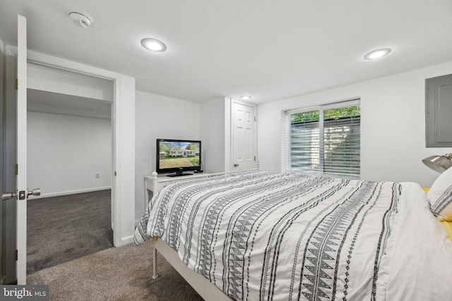 carpeted bedroom with baseboards, electric panel, and recessed lighting
