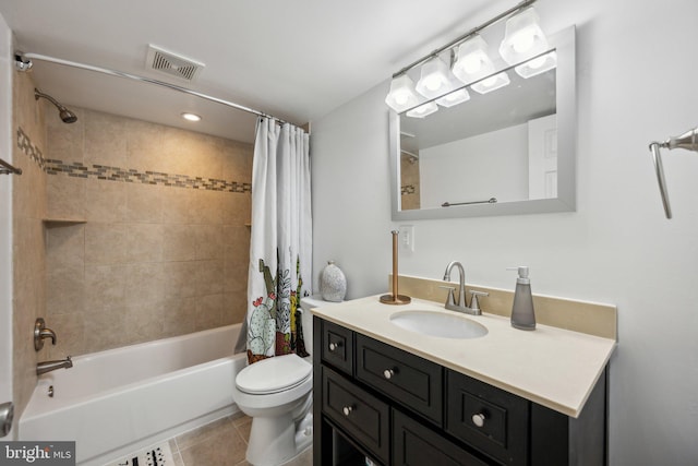 bathroom featuring visible vents, tile patterned floors, vanity, toilet, and shower / tub combo with curtain