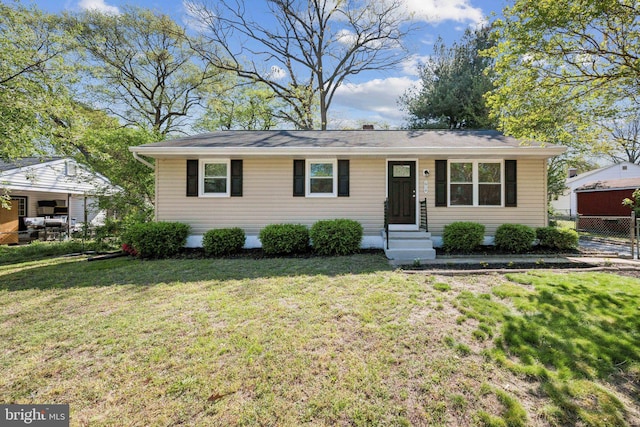 single story home featuring fence and a front lawn