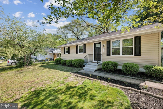 ranch-style house with a front lawn