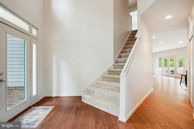 1145 Water Pointe Ln, Reston, VA 20194 - stairs featuring wood finished floors, baseboards, and recessed lighting