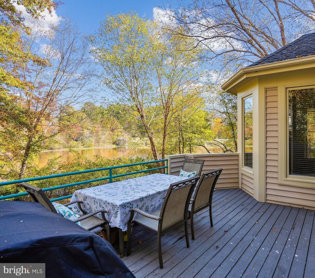 wooden deck with outdoor dining area