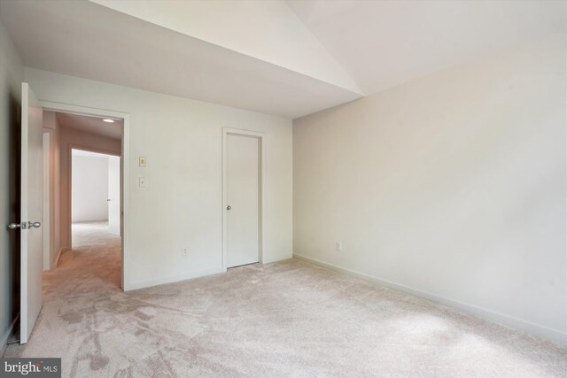 1145 Water Pointe Ln, Reston, VA 20194 - unfurnished bedroom with light colored carpet, vaulted ceiling, and baseboards