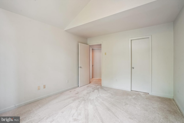1145 Water Pointe Ln, Reston, VA 20194 - unfurnished bedroom featuring carpet, lofted ceiling, baseboards, and a closet
