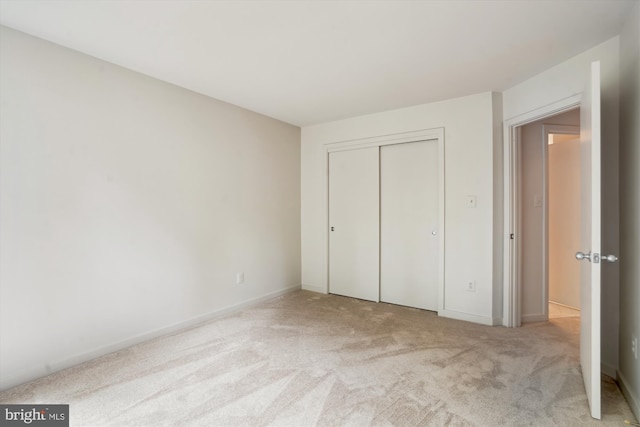 1145 Water Pointe Ln, Reston, VA 20194 - unfurnished bedroom featuring carpet flooring, a closet, and baseboards