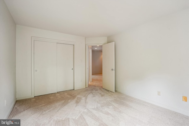 1145 Water Pointe Ln, Reston, VA 20194 - unfurnished bedroom featuring light carpet, a closet, and baseboards