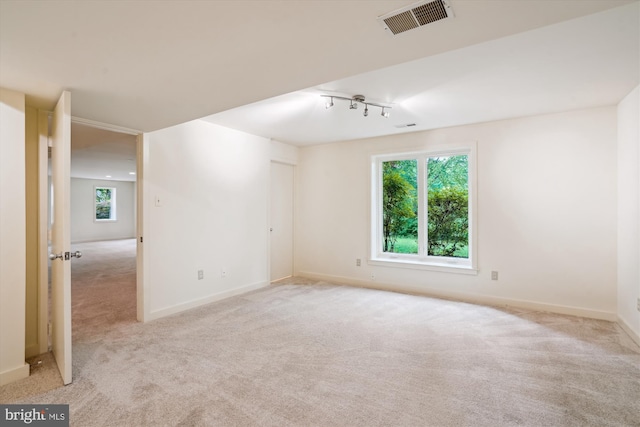 1145 Water Pointe Ln, Reston, VA 20194 - carpeted empty room featuring healthy amount of natural light, track lighting, and baseboards