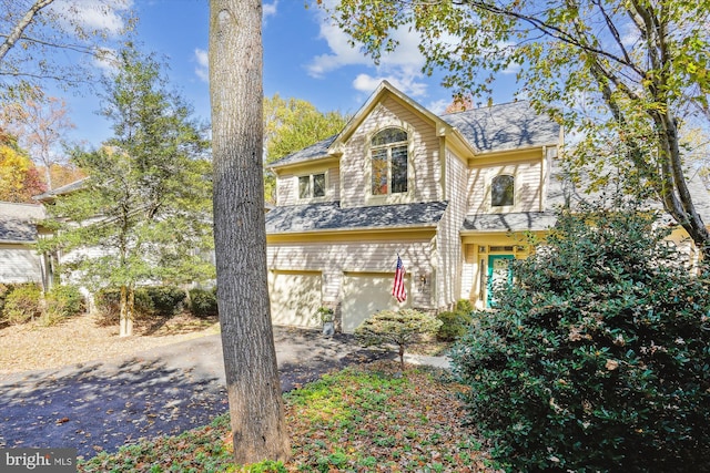 1145 Water Pointe Ln, Reston, VA 20194 - view of front facade featuring asphalt driveway and an attached garage